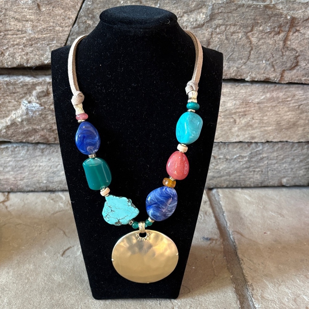 Chico’s multi colored statement necklace with large gold circle pendant